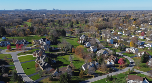 Exurban homes near Rochester, NY, with distant view of city