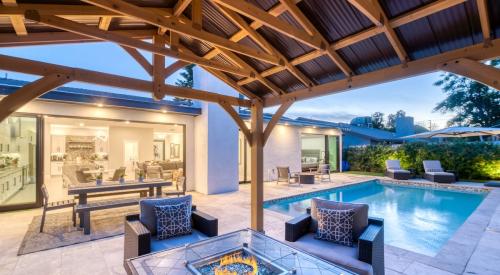 House backyard with pool and covered dining for outdoor living