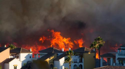 Homes next to hillside on fire in California
