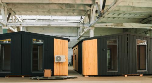 Off-site fabrication of modular houses in a factory