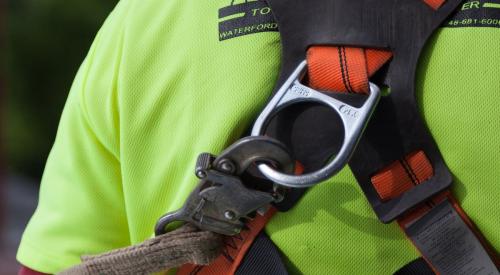 Safety clip on construction worker harness