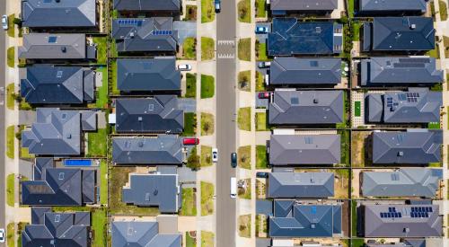 Crowded residential neighborhood with homes on small lots seen from above