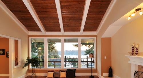 Dark wood paneling on living room ceiling
